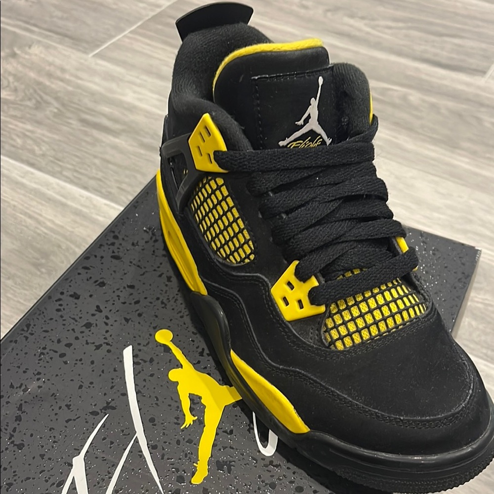 Jordan Air 4 Retro Black and Tour Yellow